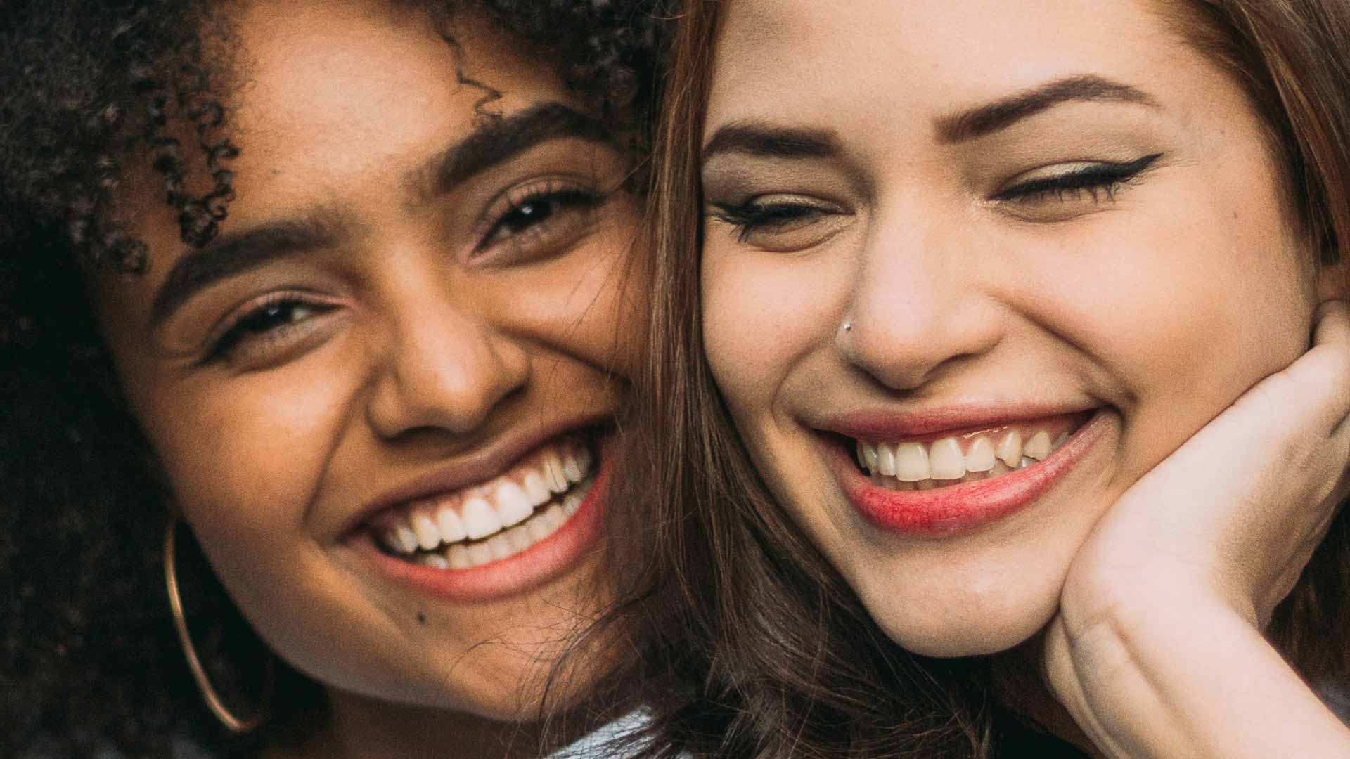 Signature Dental Aesthetics two women smiling organic