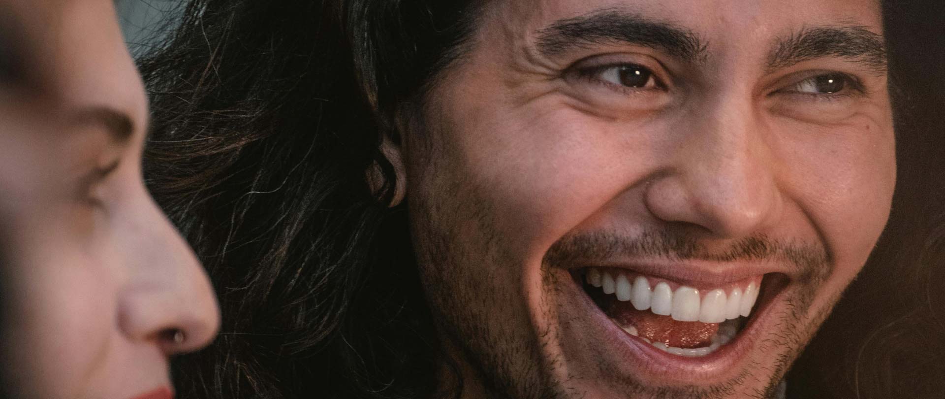 Signature Dental Aesthetics smiling with visible teeth