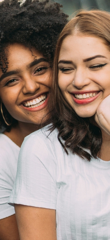 Signature Dental Aesthetics two women smiling organic mobile