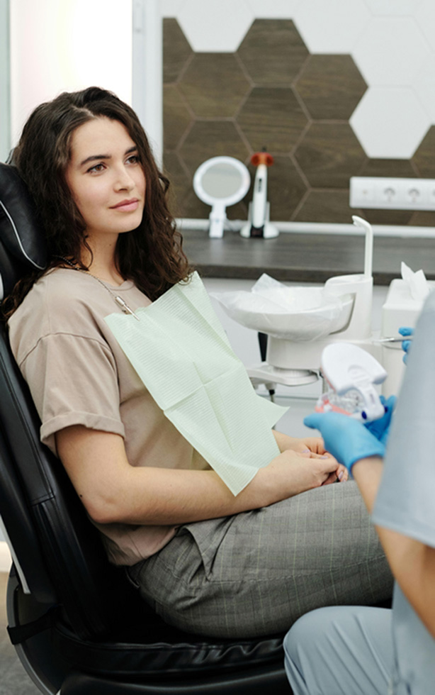 Signature Dental Aesthetics woman in dentist chair